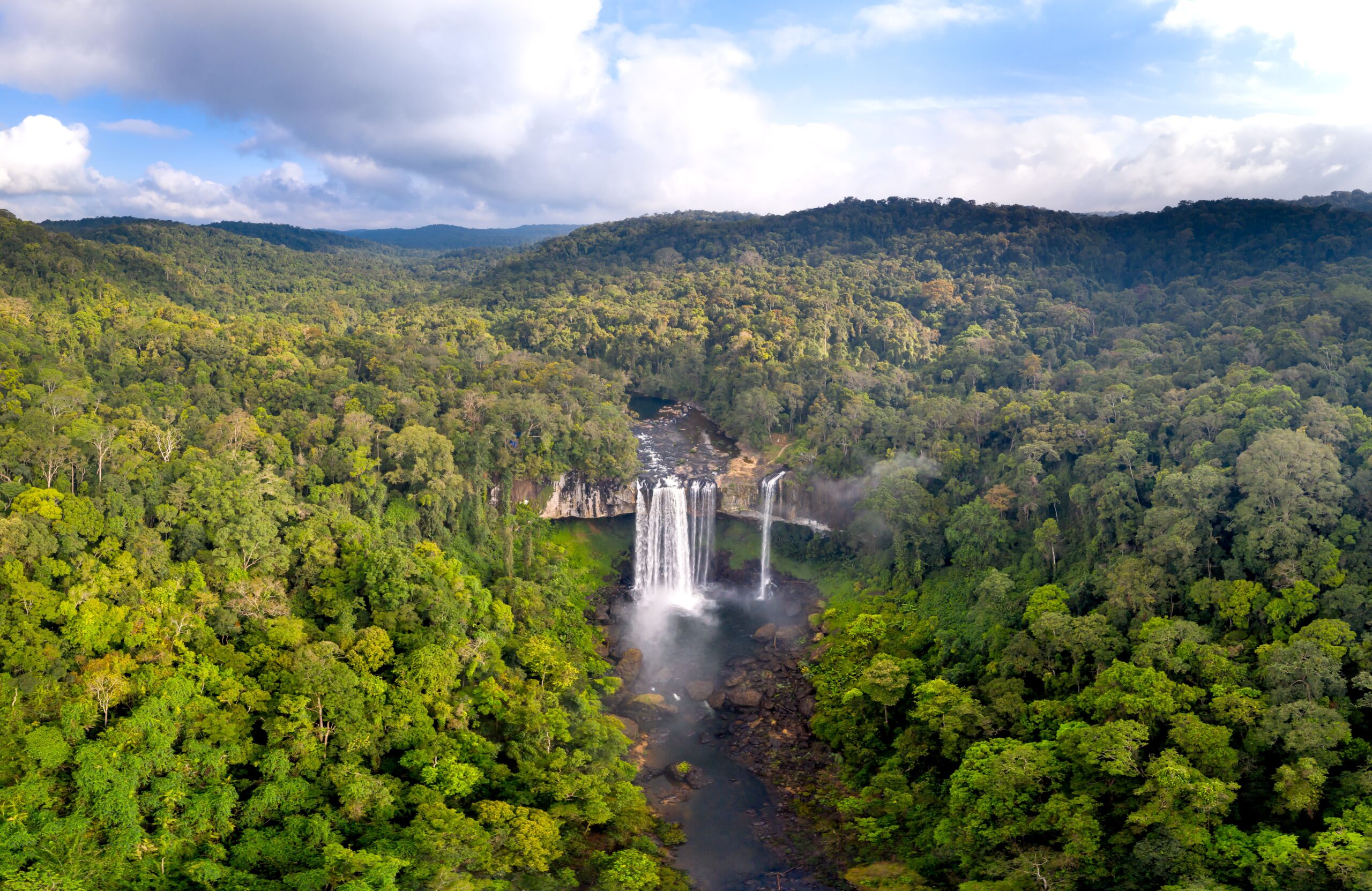 Aerial view of a forest waterfall at Kon Chu Rang Nature Reserve in Vietnam