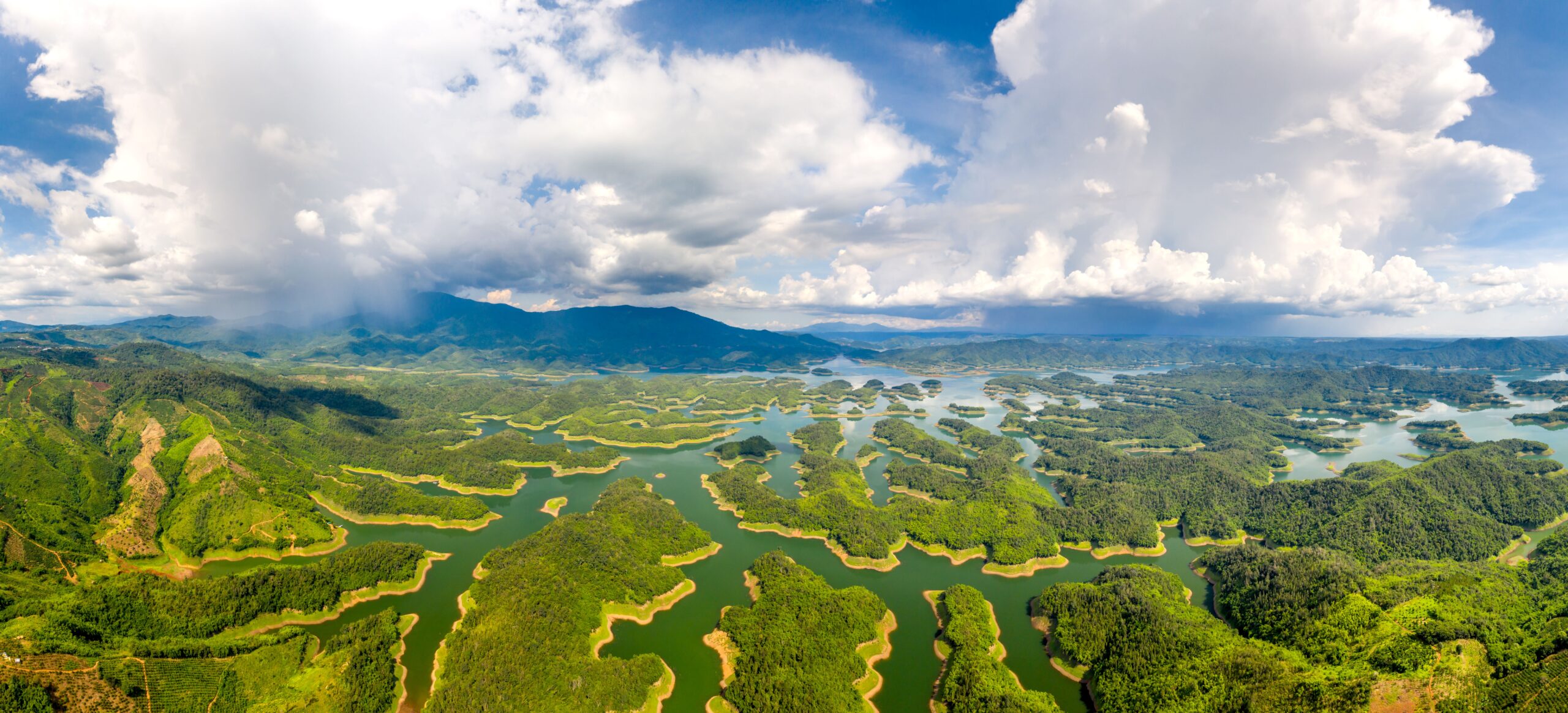 A wide aerial view of Ta Dung National Park’s green islands and waterways