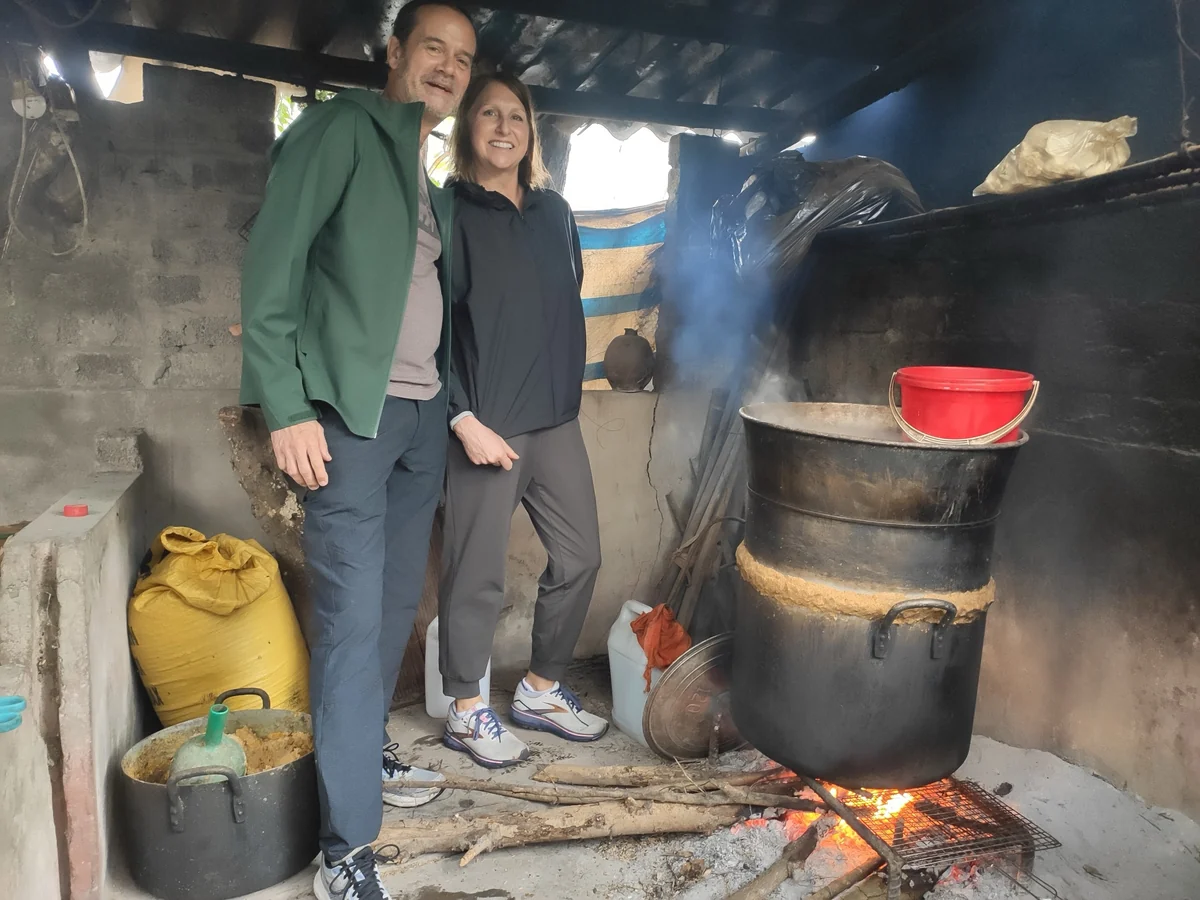 Guests inside a traditional local farmhouse kitchen in Ninh Binh