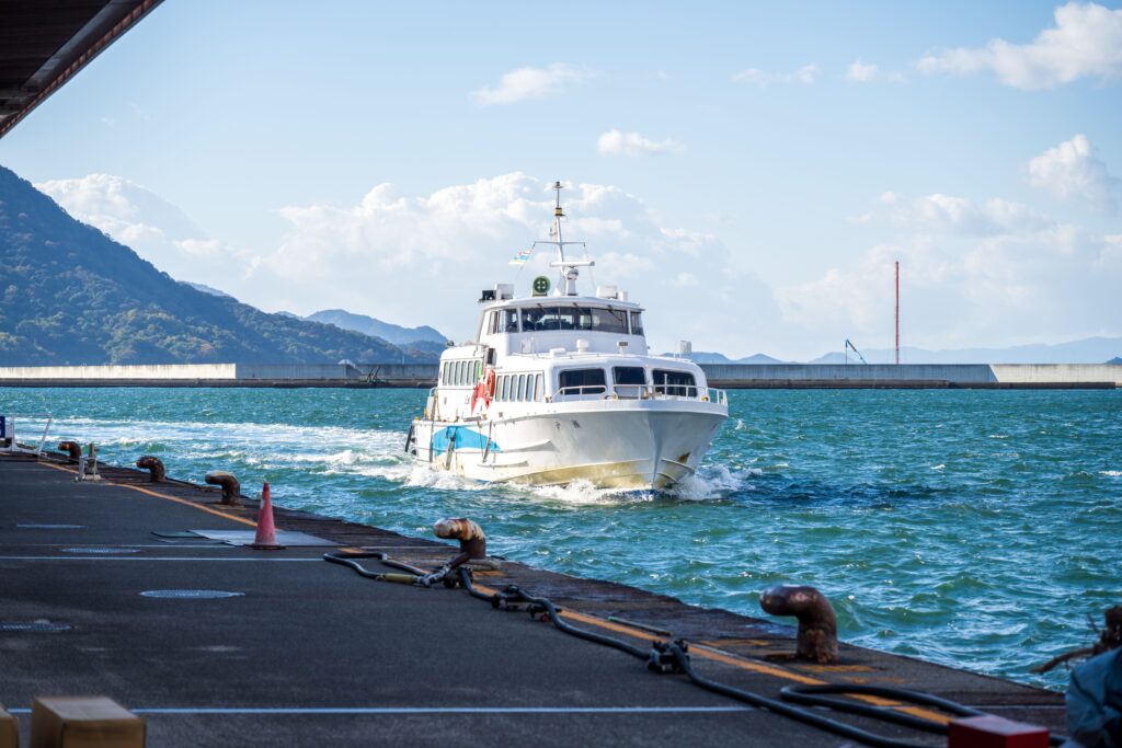 Passenger ferry approaching a harbor on open water