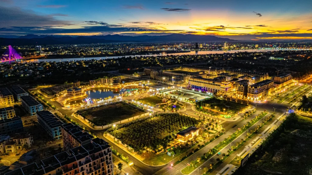 Aerial view of Regal Legend's illuminated complex in Dong Hoi at dusk.