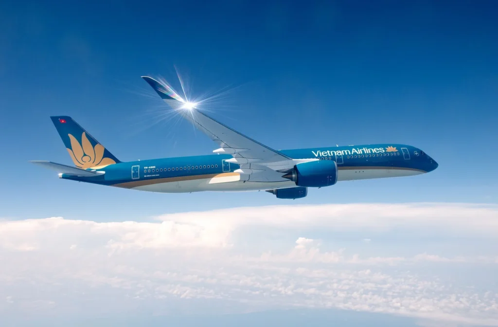 Vietnam Airlines passenger aircraft flying above clouds.