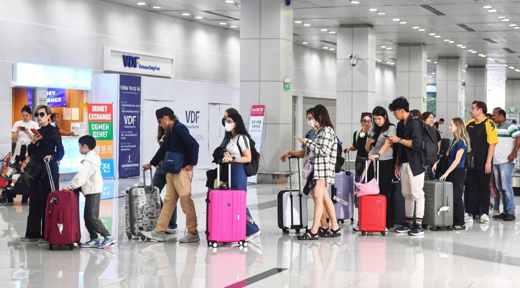 Passengers with suitcases inside Phu Quoc International Airport