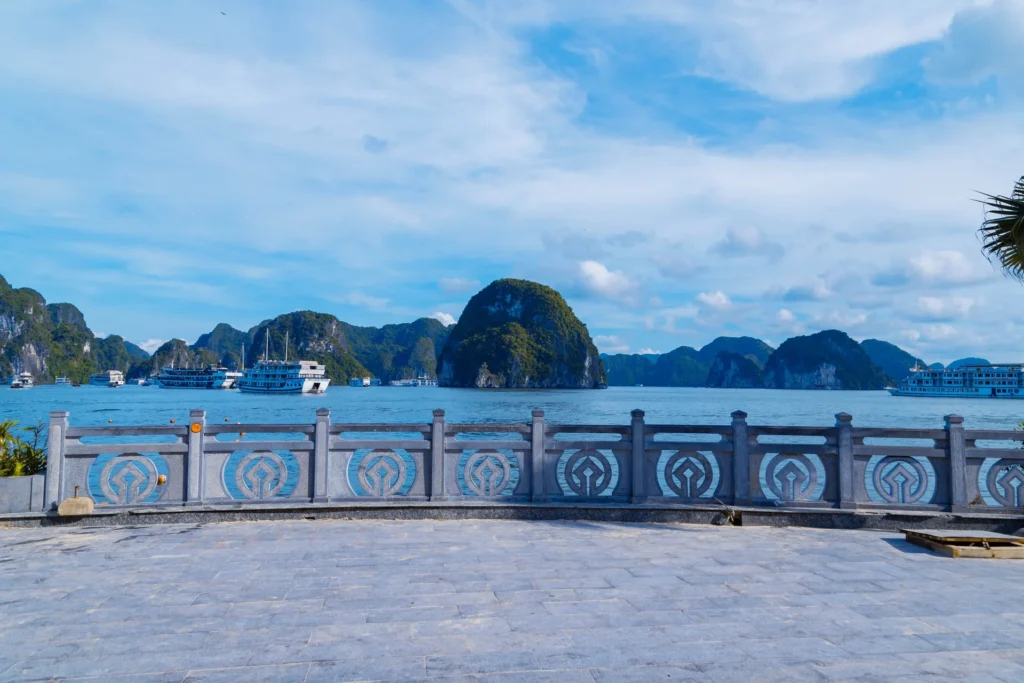 Limestone islands and cruise boats in Ha Long Bay.