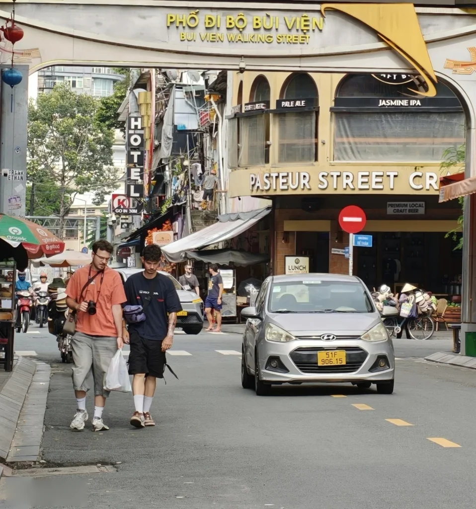 Foreign visitors walk along Bui Vien Walking Street in Ho Chi Minh City.