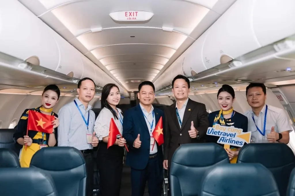 Vietravel Airlines representatives and crew at an aircraft welcome ceremony.