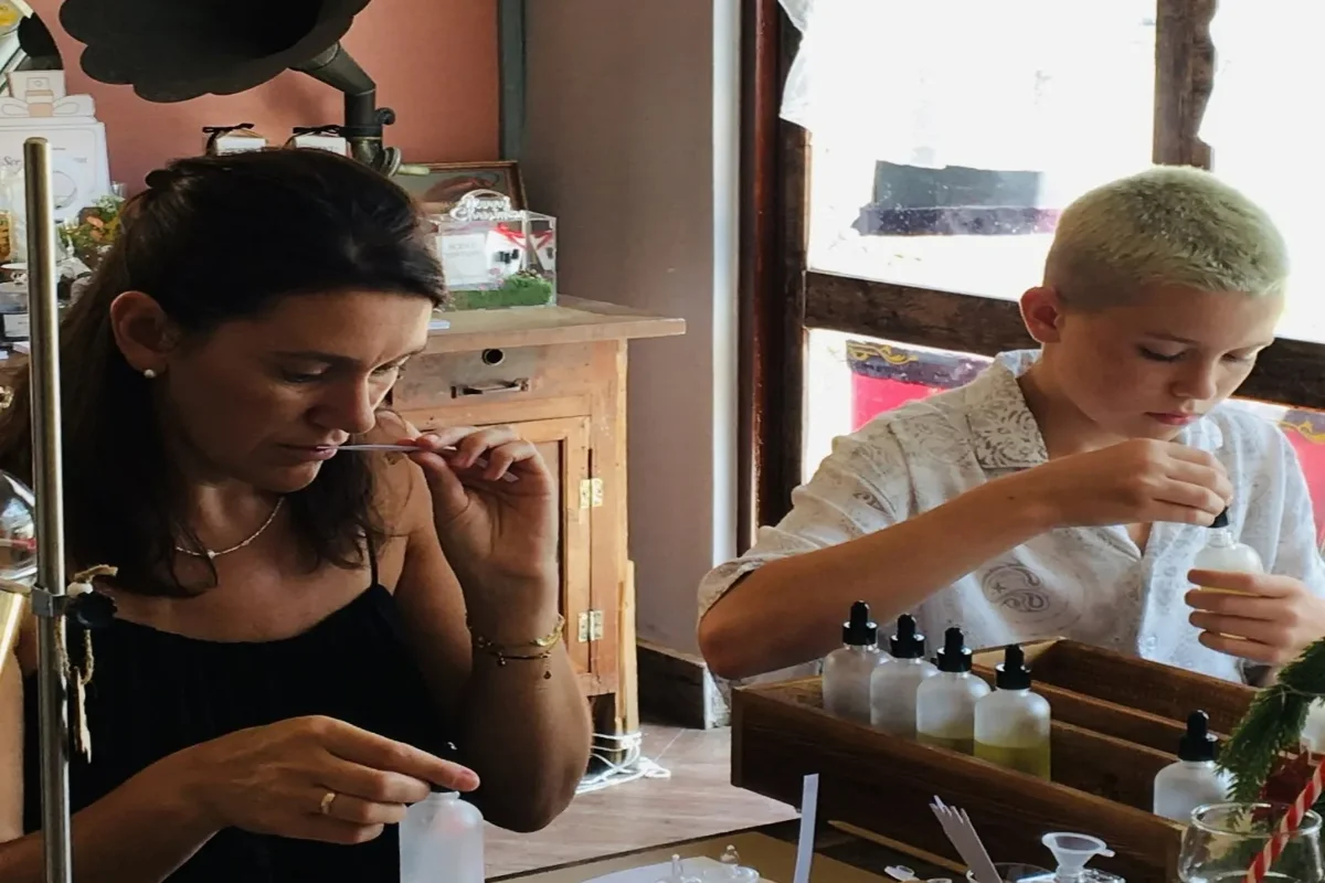 Two participants creating their own scents at the perfume workshop