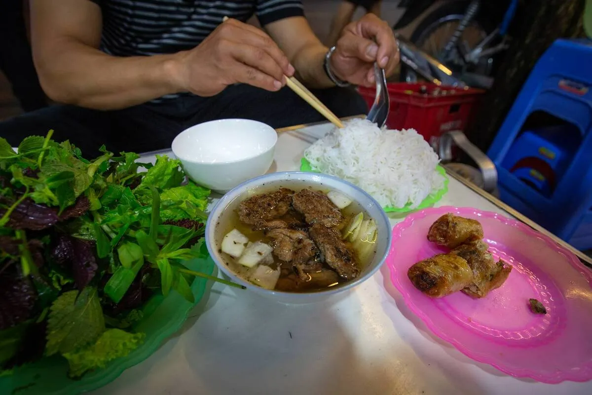 Bun cha with grilled pork, rice noodles and fresh herbs